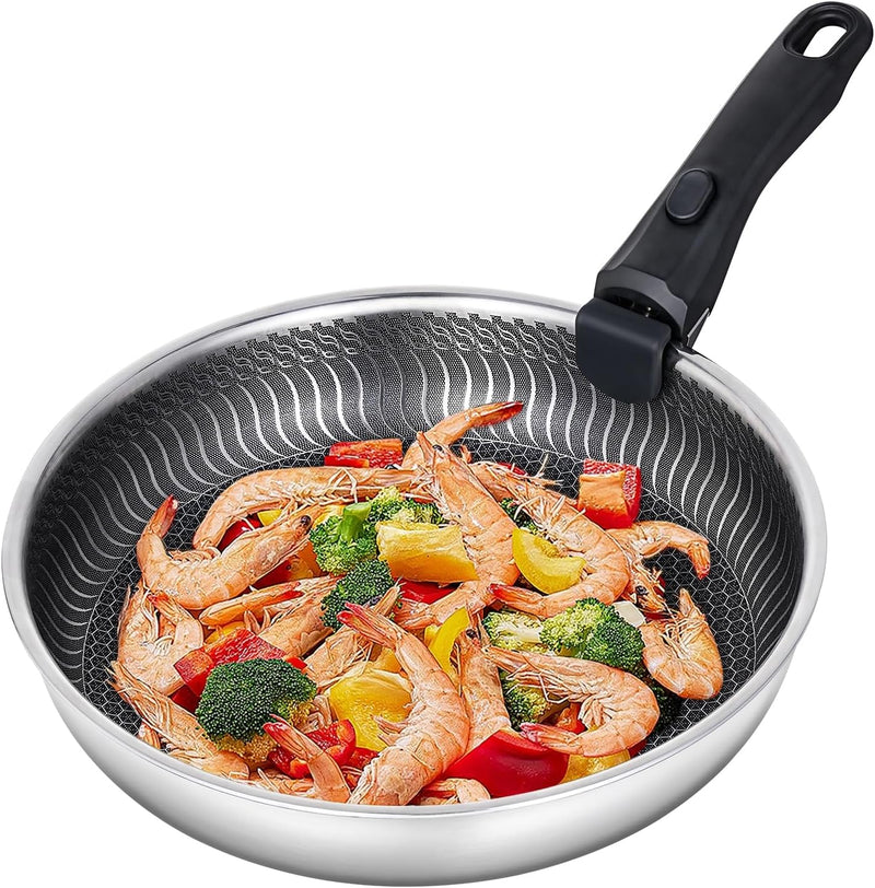 Stainless steel honeycomb non-stick frying pan, with shrimp, broccoli, bell peppers, and other ingredients being cooked inside.